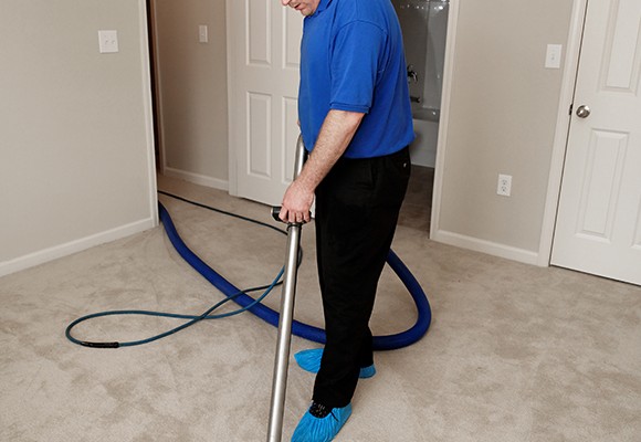 Water extraction equipment cleaning carpet after water damage